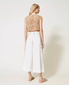 Pantaloni cropped con bande in macramè Twinset